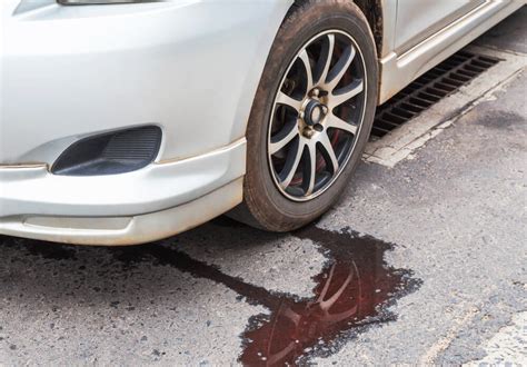 reddish brown fluid leaking from car|8 Reasons Your Car May Be Leaking Fluid